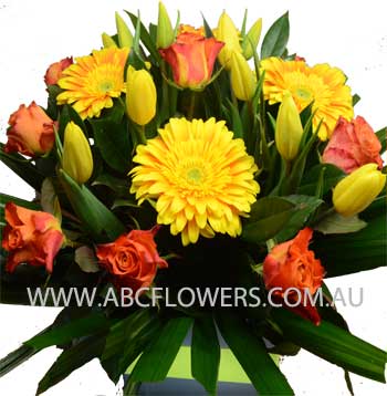 ABC Flowers St. Vincent's Hospital Melbourne Deliver A030 centre piece flowers arrangement with yellow tulips orange gerberas melbourne wide